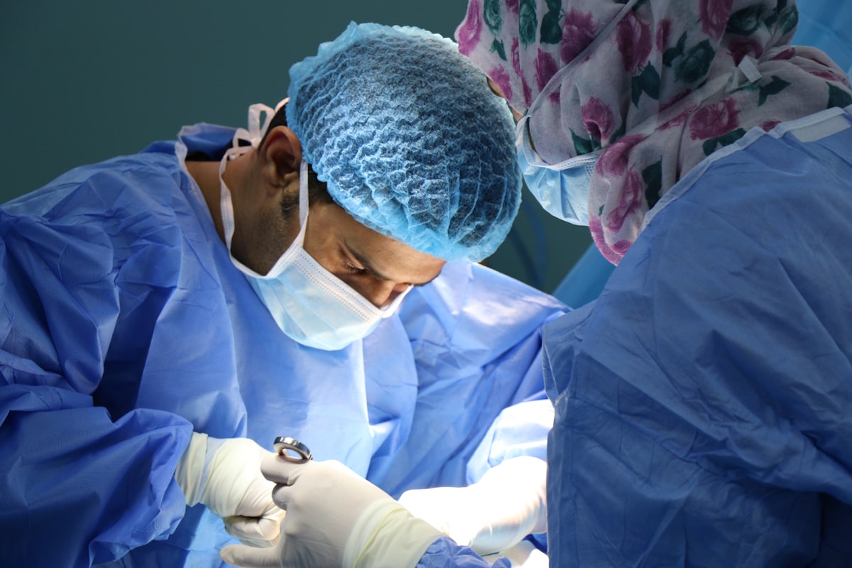Orthopedic surgeon reviewing X-ray images in an operating room setting
